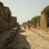 Photos de rue pavée de avec ses murs de maison bien conservé à Pompei